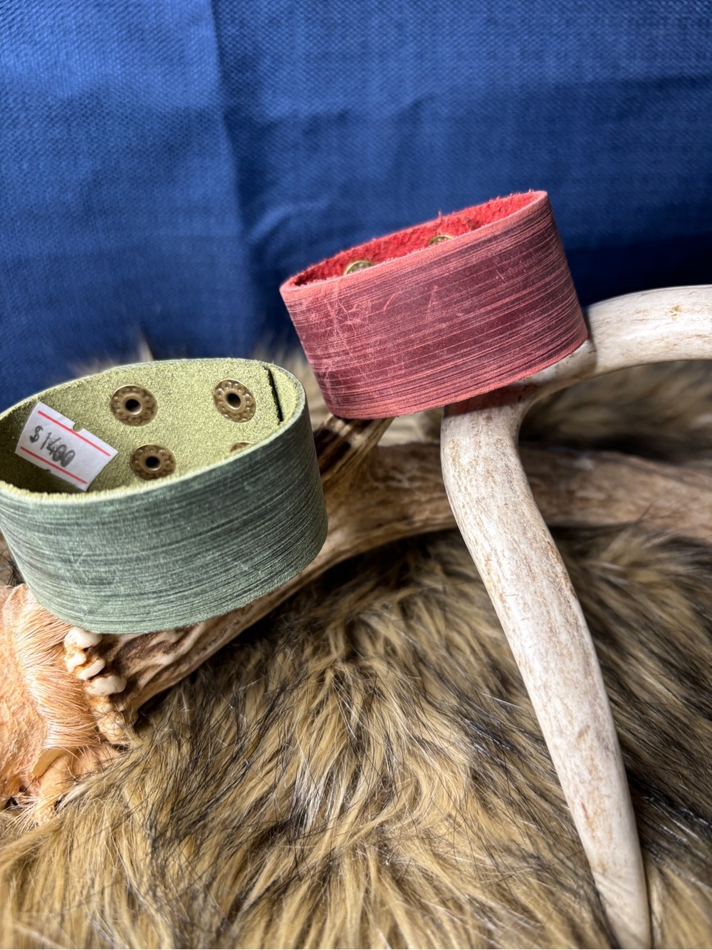 A pair of Handcrafted Leather Cuff Bracelet - Green and Red